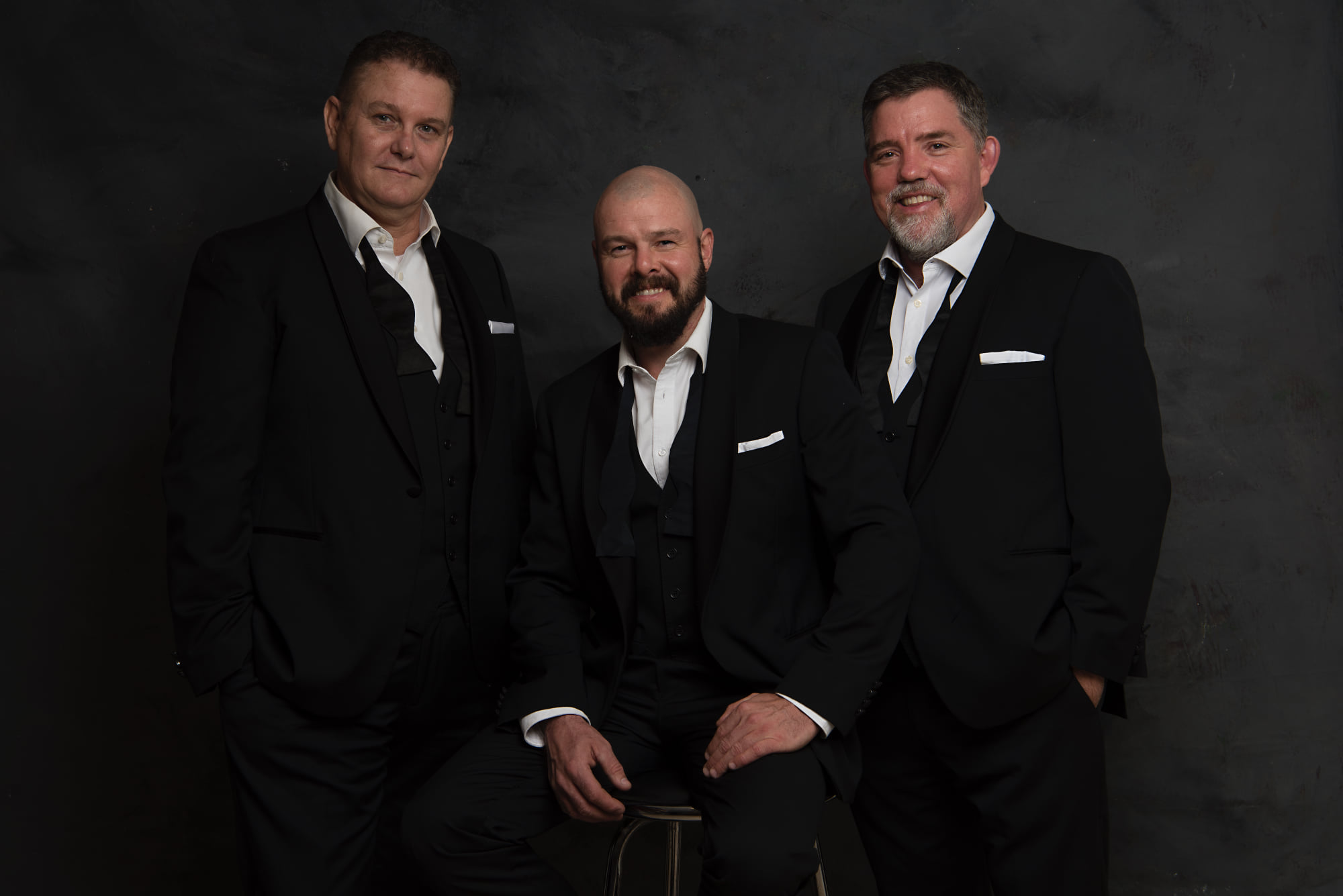 Trio of men from singing group Tenoir